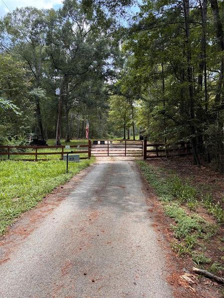 road leading to secure electronic gate