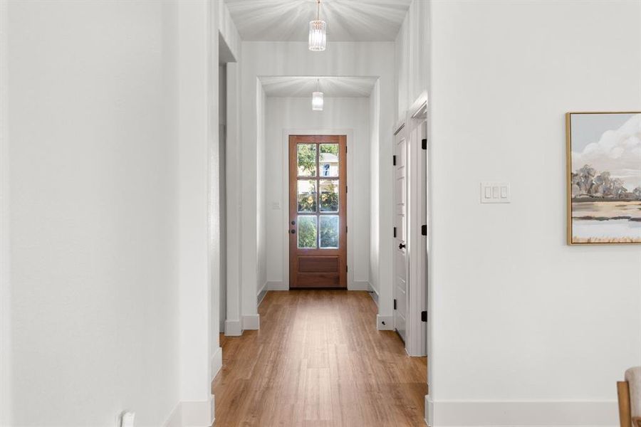 Doorway to outside with light hardwood / wood-style flooring