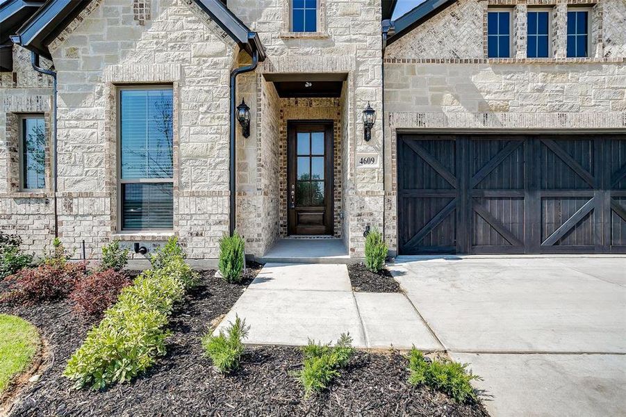 Entrance to property with a garage