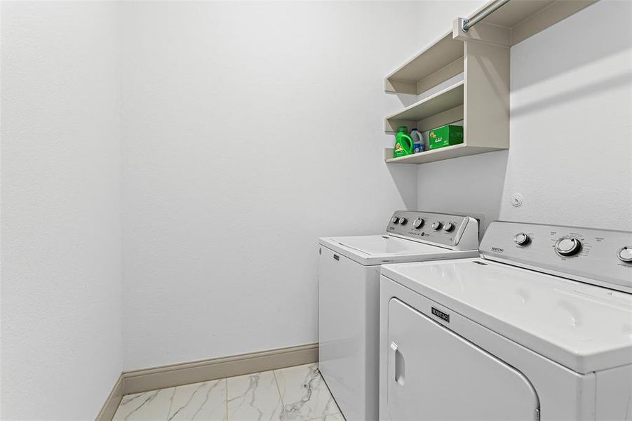 Laundry area featuring washer and clothes dryer