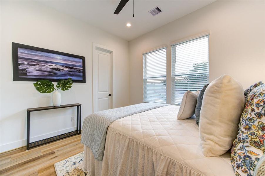 Guest Bedroom 2. All bedrooms feature LVP flooring, recessed LED lights, sleek black ceiling fans and large walk-in closets.