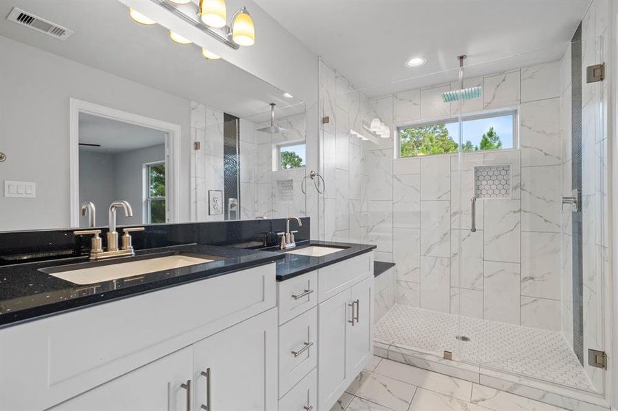 Master bath with his and her sinks and walk-in shower