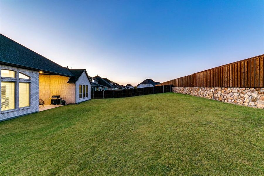 View of yard at dusk