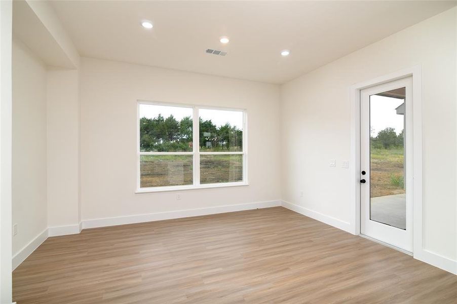 Spare room featuring light hardwood / wood-style floors