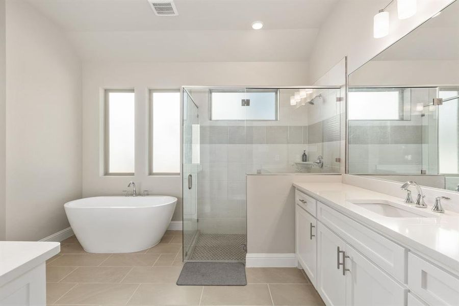 Bathroom with vanity, separate shower and tub, and tile patterned floors