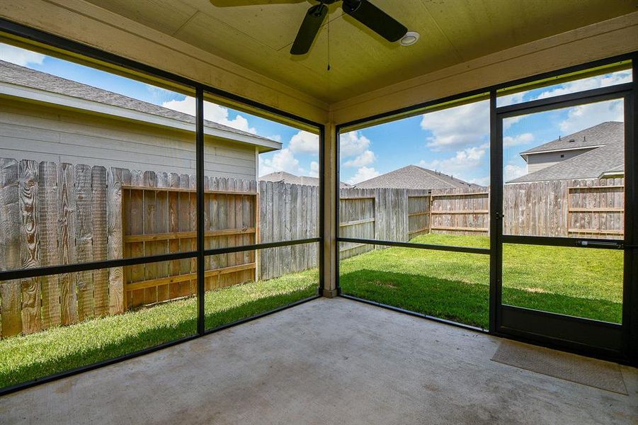 Screened patio offers a comfortable outdoor living or dining area, perfect for relaxation and entertainment.