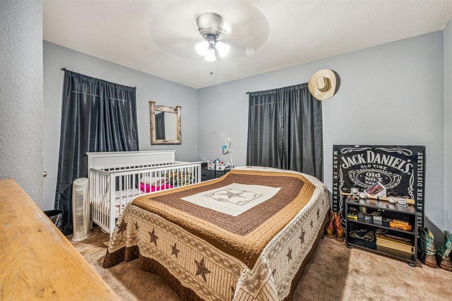 Bedroom with carpet flooring and ceiling fan