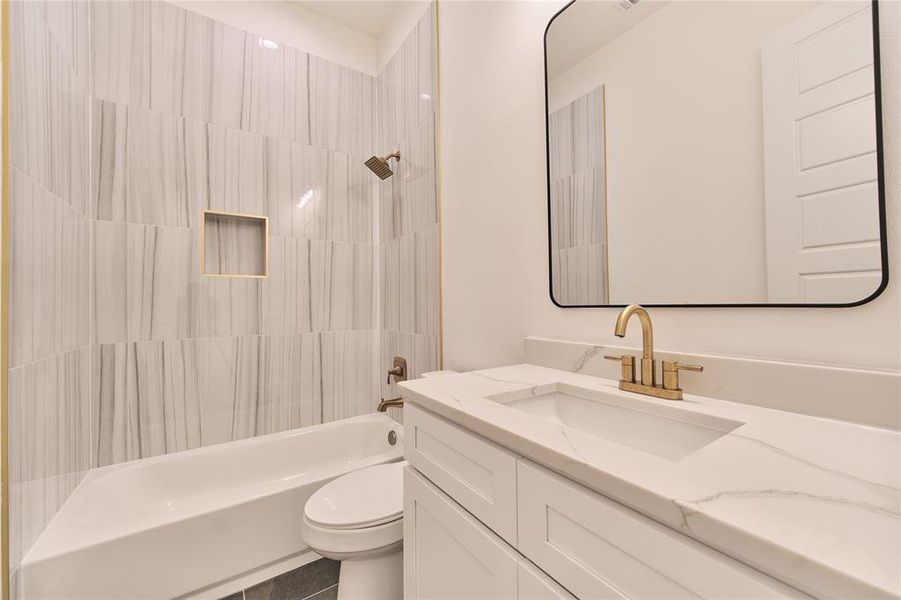 Full bathroom with shower / bath combination with curtain, vanity, toilet, and tile patterned floors