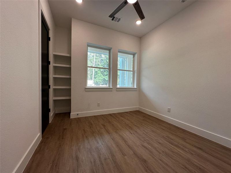 Front bedroom with closet and built ins could be study.