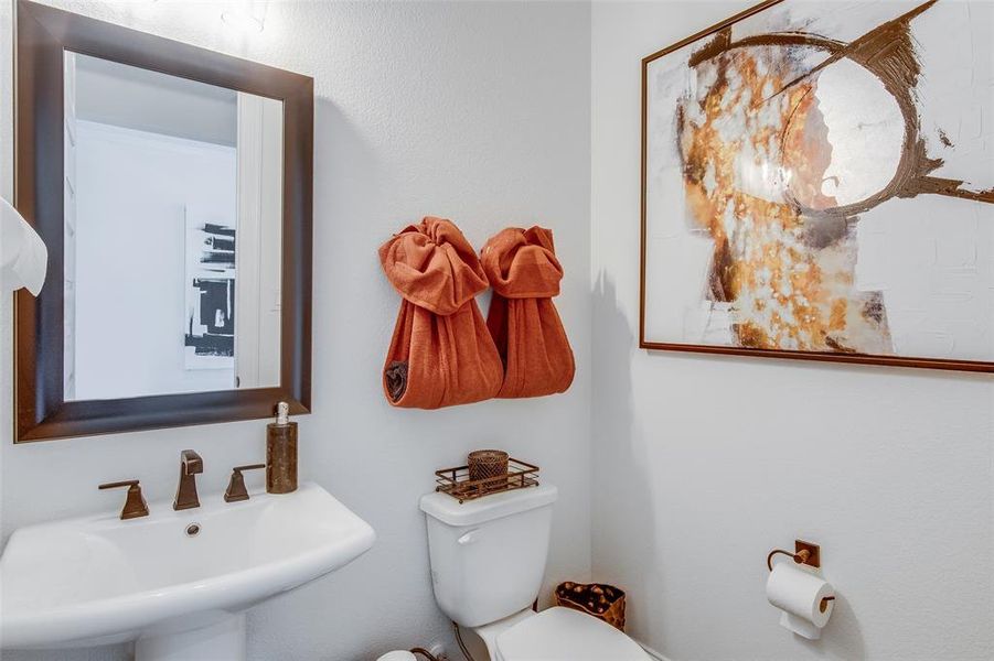 Bathroom featuring sink and toilet