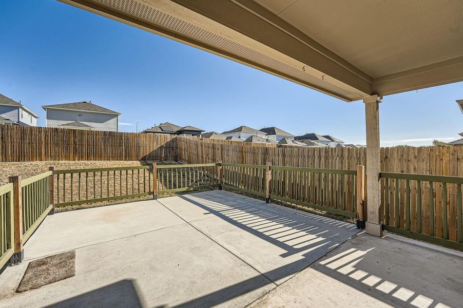 Extended covered patio with fence