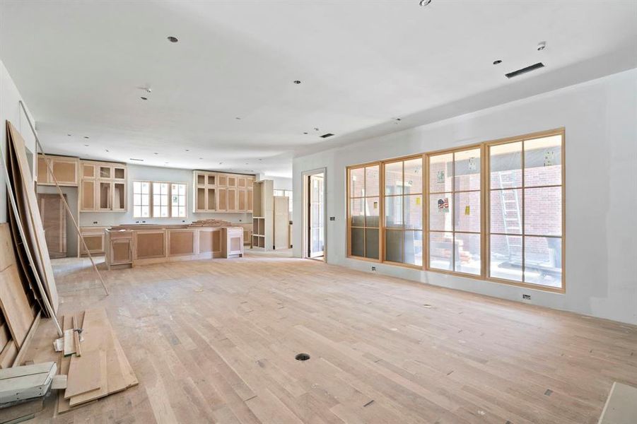 Progress Photos June 2024- living room featuring light hardwood / wood-style floors