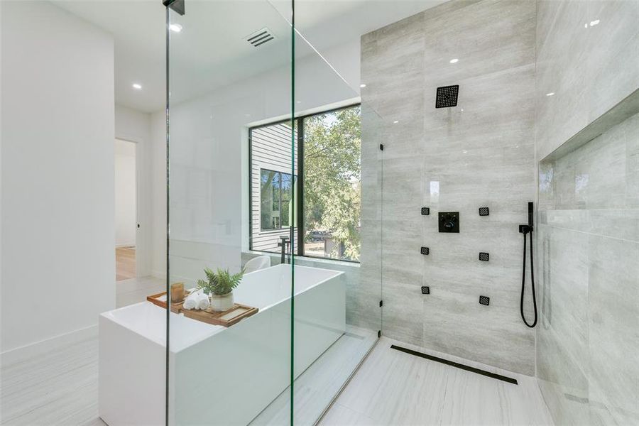 Bathroom featuring separate shower and tub