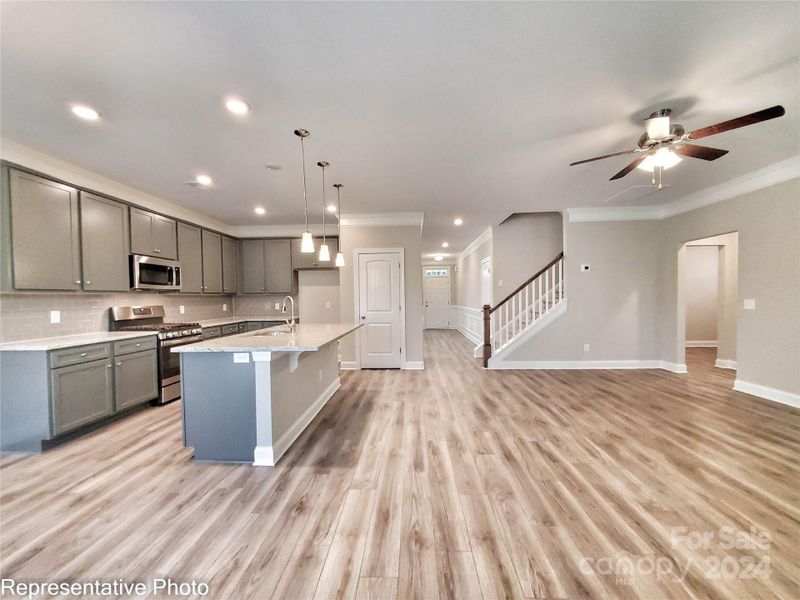 This home features white cabinets and white marbled quartz countertops