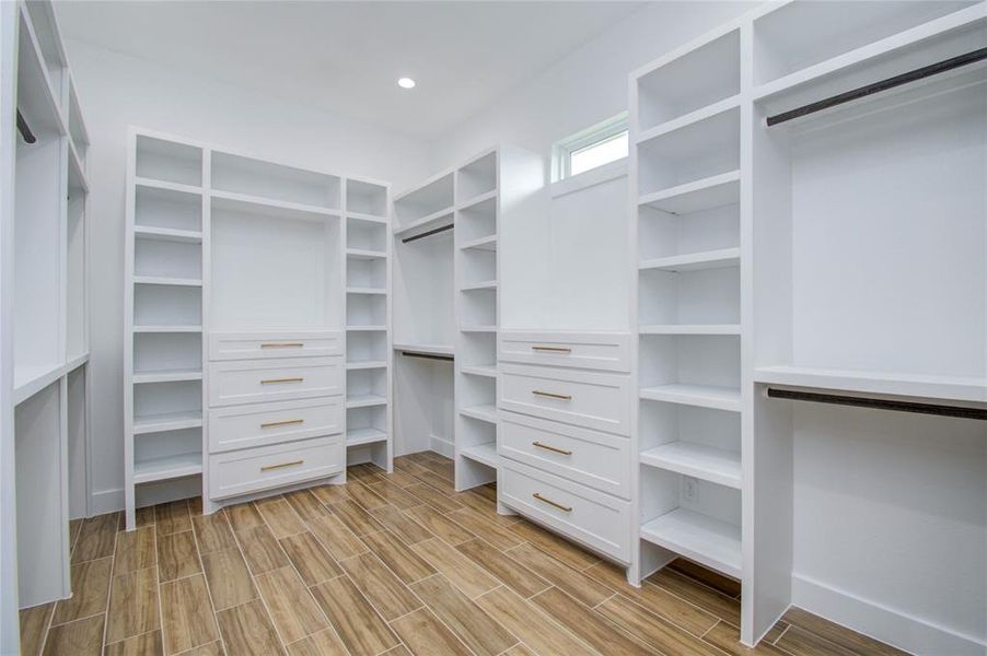 Large walk in closet with custom space