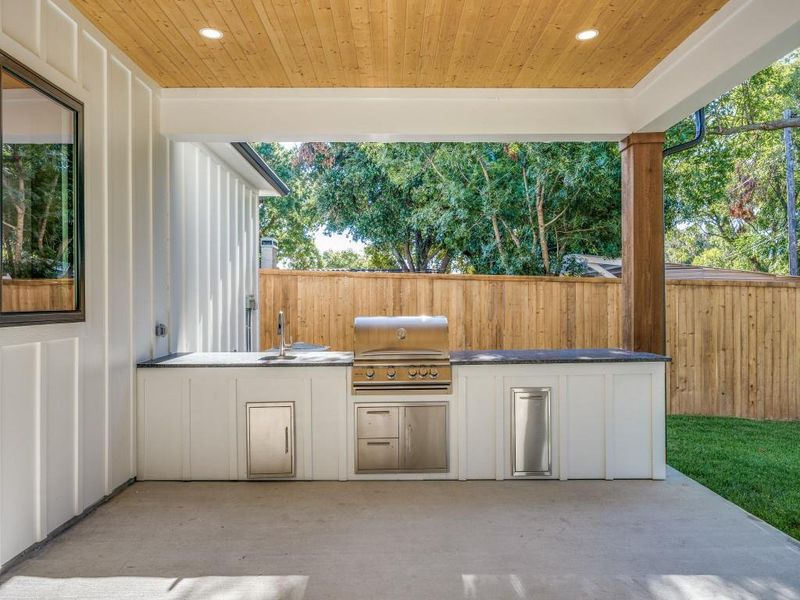 View of patio / terrace featuring sink, an outdoor kitchen, and area for grilling