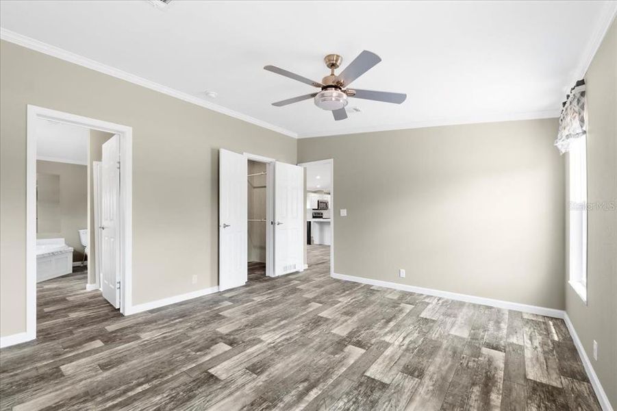 Primary Bedroom w/ view of En-Suite & Walk-In Closet