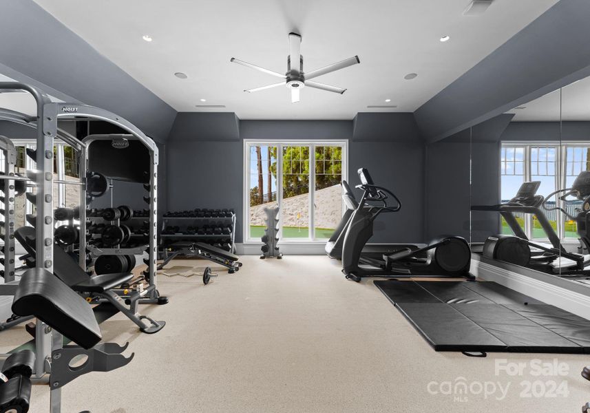 This gym is equipped with a full bathroom, surround sound, and ample space.