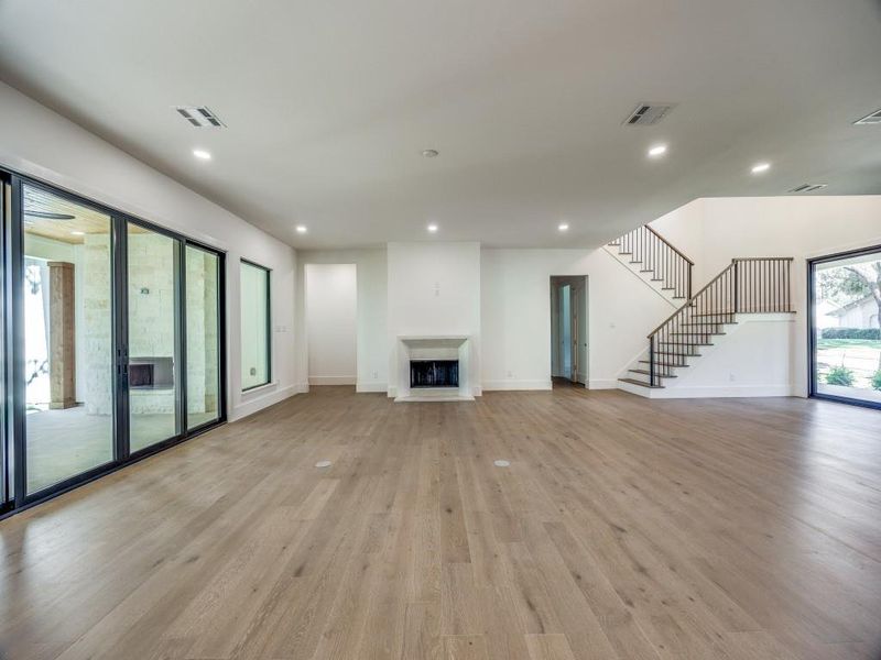 Unfurnished living room with light hardwood / wood-style floors