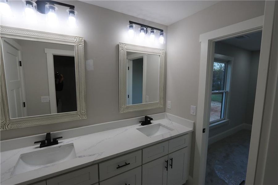 Bathroom with dual sinks and large vanity