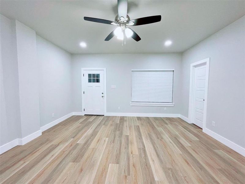 Spare room featuring ceiling fan and light hardwood / wood-style flooring