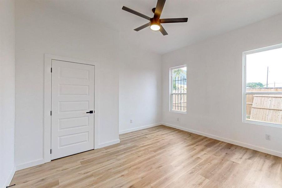 Unfurnished room featuring ceiling fan and light hardwood / wood-style flooring