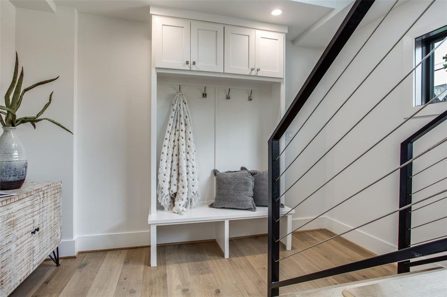 Mudroom featuring light wood flooring