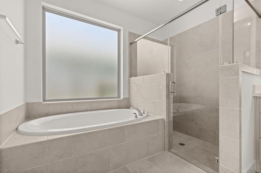 Primary Bathroom - Featuring a Walk-in Shower & Soaking Tub