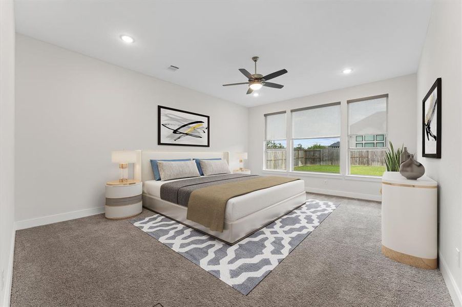 The spacious master bedroom is a true retreat, featuring plush carpeting and wide windows that fill the room with soft, natural light.