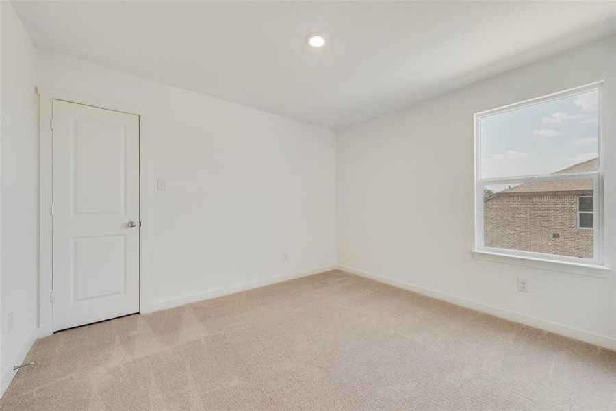 View of carpeted spare room