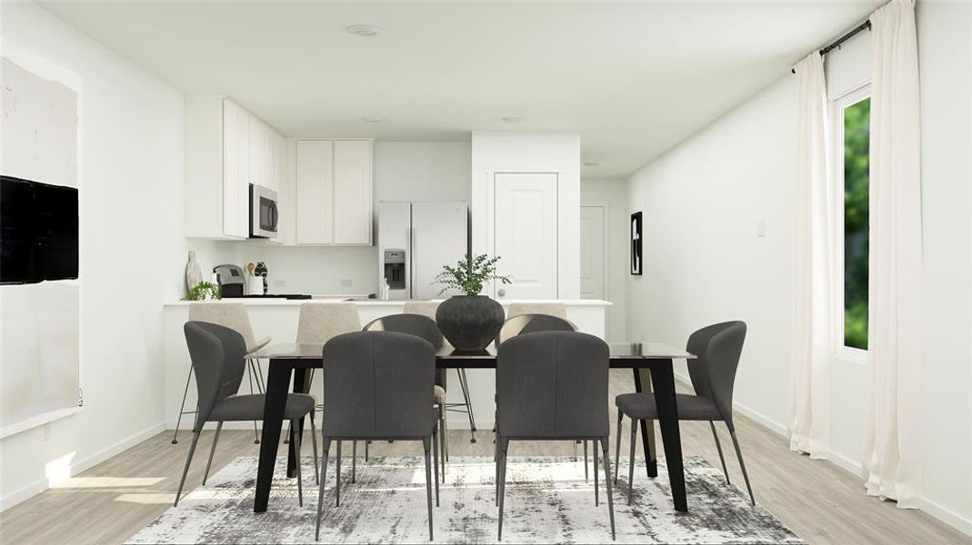 Dining area with light hardwood / wood-style floors