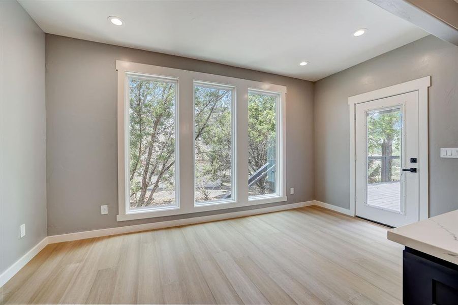 Tons of windows in breakfast area - door to back yard deck