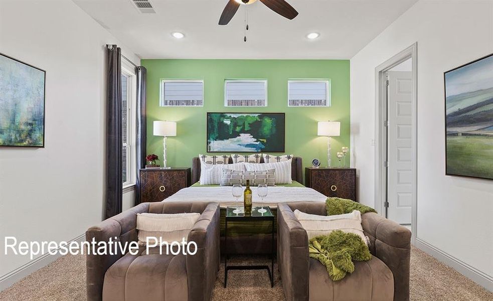 Bedroom with ceiling fan and carpet flooring