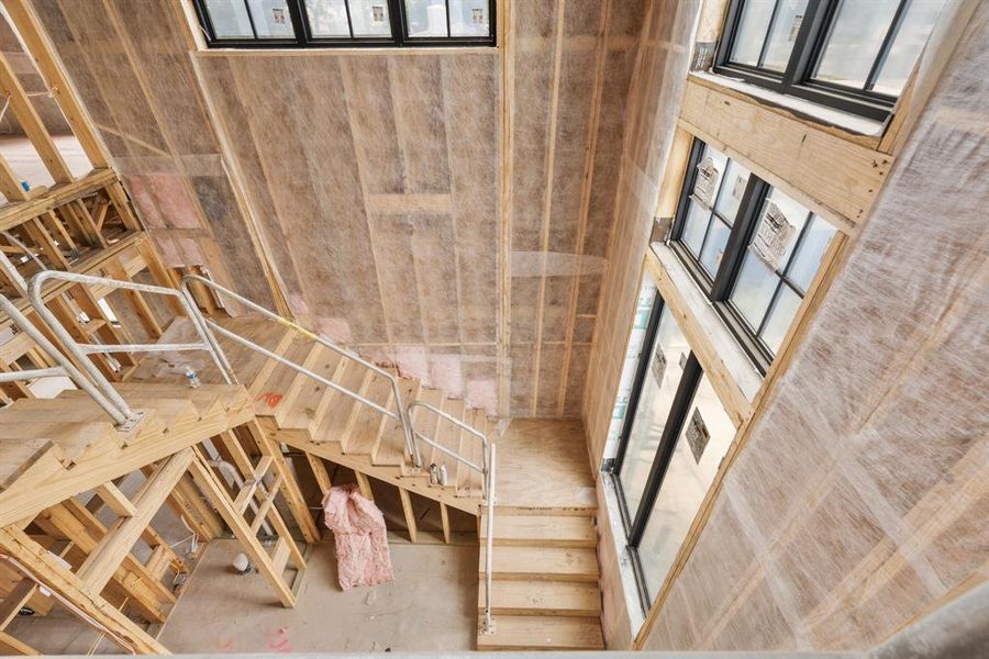 The grand stair hall is a focal point of the home inside and out!