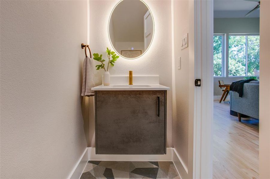 Bathroom featuring vanity and hardwood / wood-style flooring