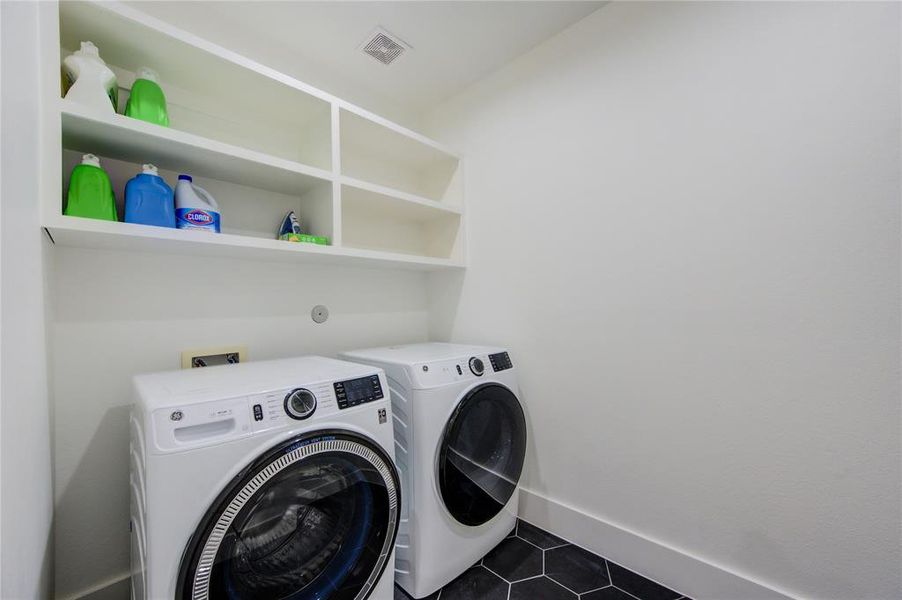 Large laundry room with storage