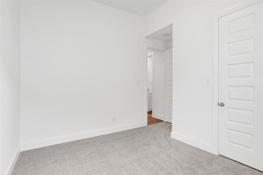 Unfurnished bedroom with carpet floors