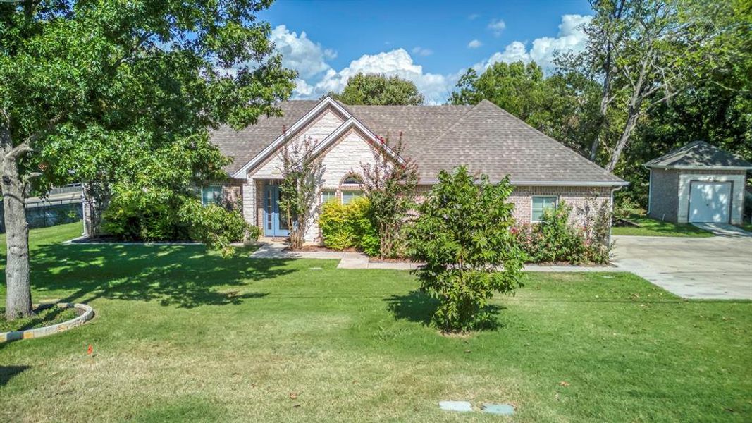 Warm and inviting home nestled adjacent to Cleburne's Buffalo Creek ant Hulen Park on .859 acres