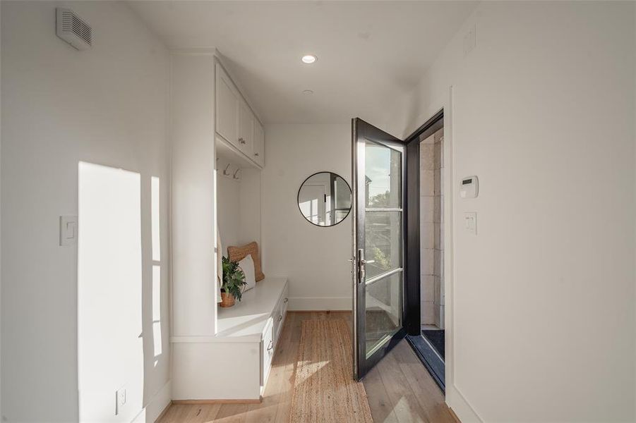 Corridor featuring light hardwood / wood-style floors