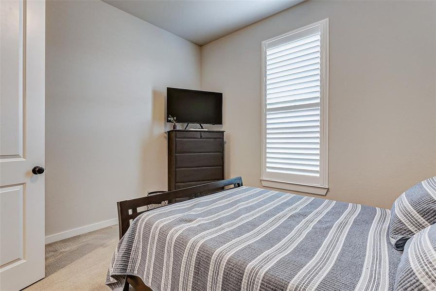 This large bedroom is tucked away from all the action for privacy.