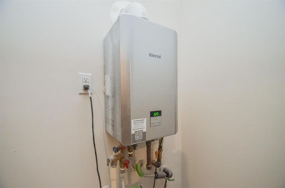 This modern Rinnai tankless water heater provides instant, energy-efficient hot water for the entire home, ensuring comfort while saving on utility costs.