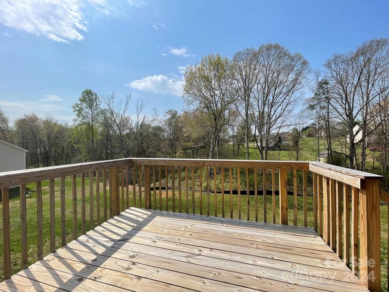 Deck overlooking backyard