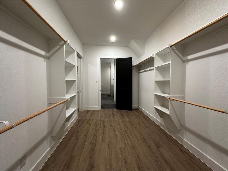 Large Walk in Primary closet with access to bathroom and utility room