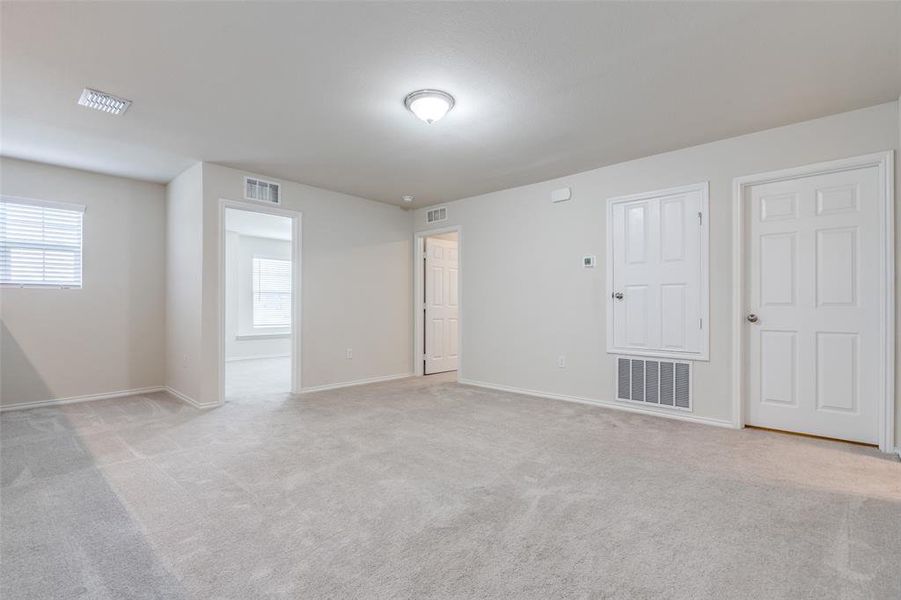 Unfurnished room with carpet