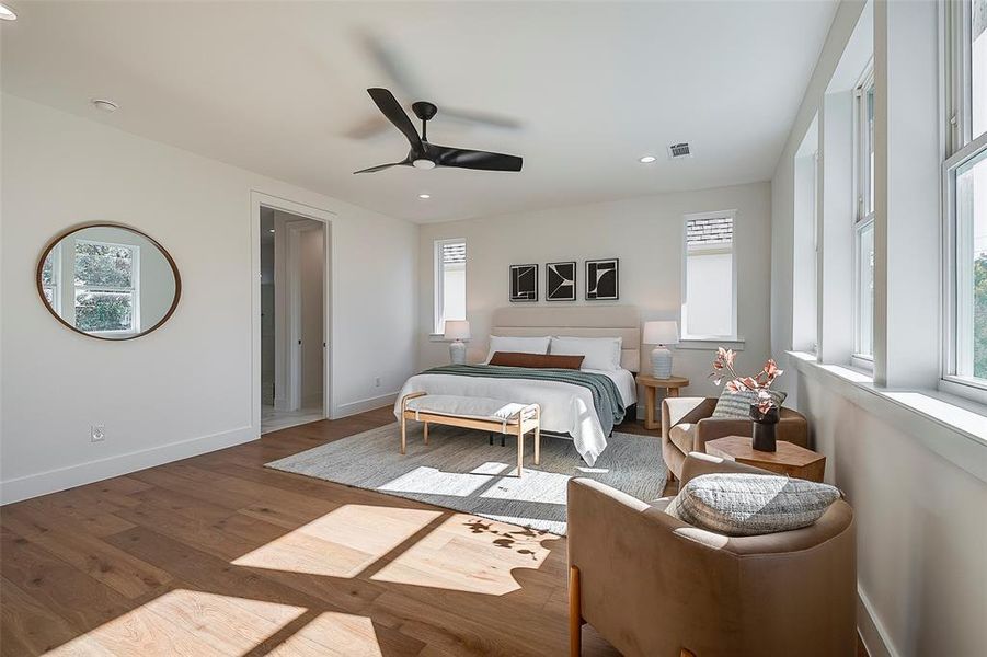 Bedroom featuring ceiling fan and hardwood / wood-style floors