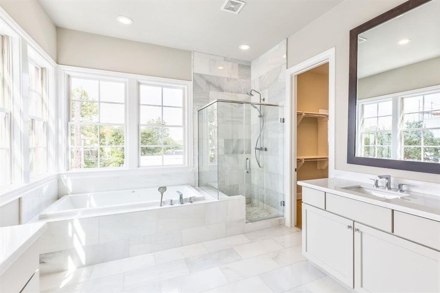 Gorgeous imperial white marble bathroom. flooded with natural light and DOWNTOWN views from the giant windows.