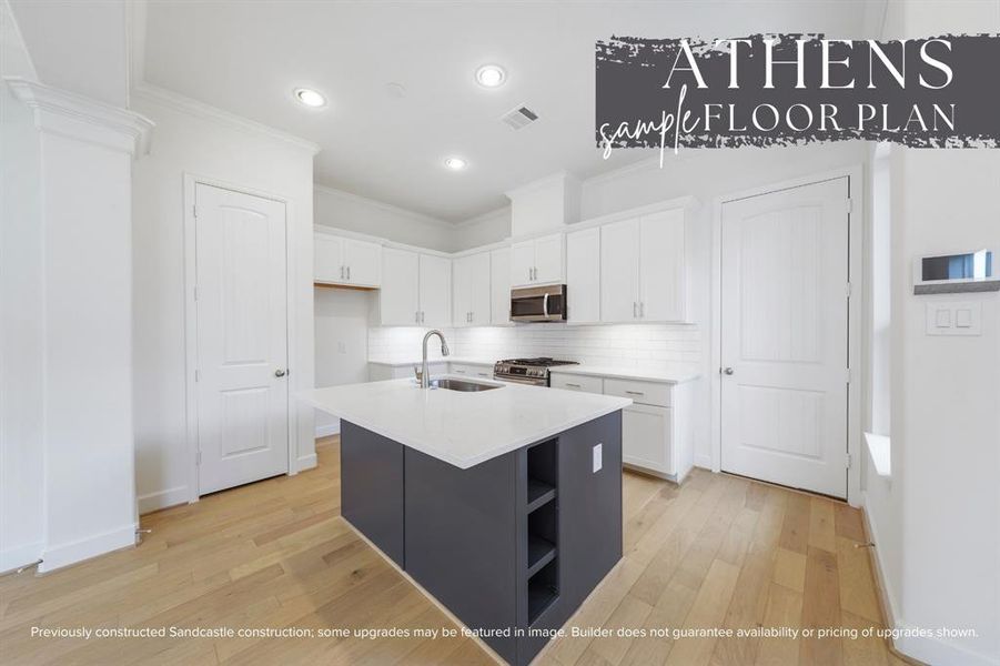 Discover a kitchen where functionality meets style, featuring an island with open shelves perfect for displaying your culinary treasures.