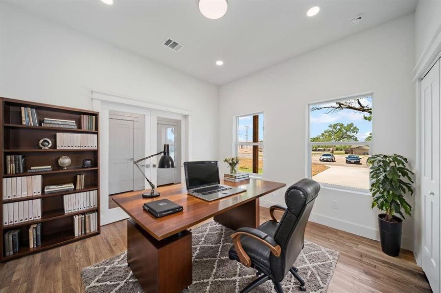 Office featuring hardwood / wood-style floors