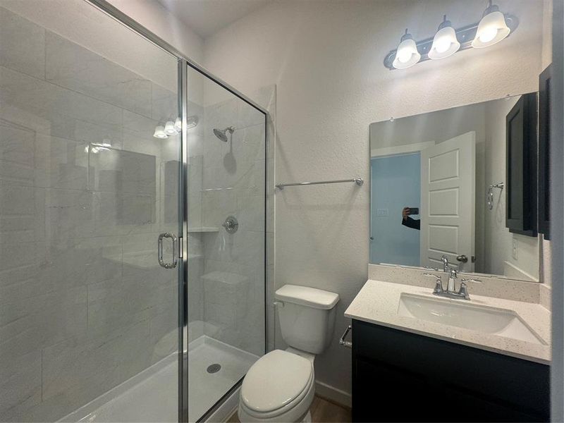 The on suite includes a full stand-up shower.