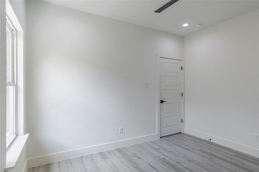 Spare room with light wood-type flooring